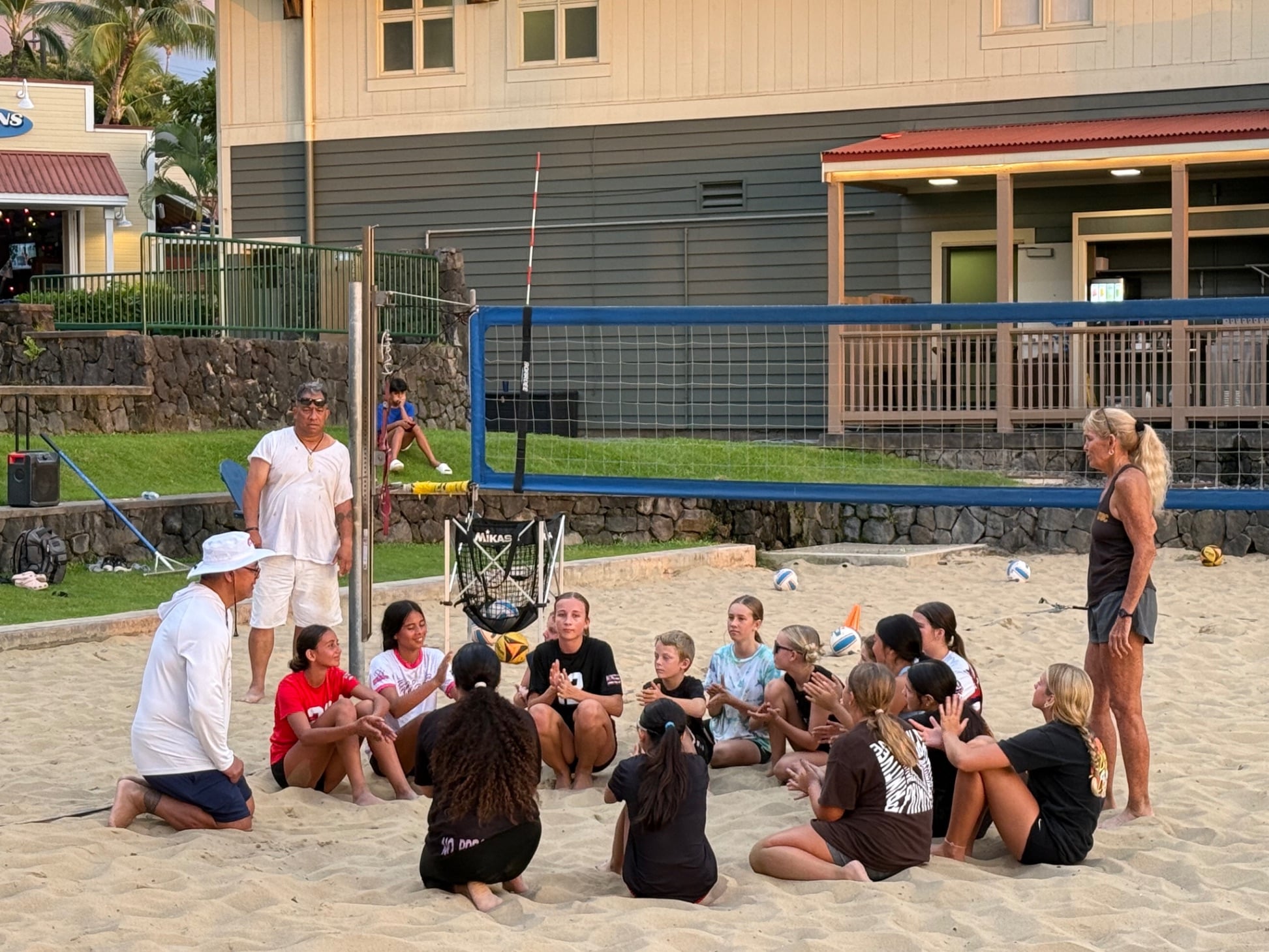 Youth volleyball team celebrating together